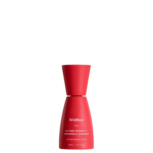 Wildfleur XC15 15% pure vitamin C serum in an orange bilayer bottle